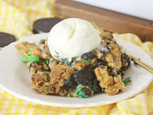 chocolate mint dump cake on a plate, topped with ice cream.